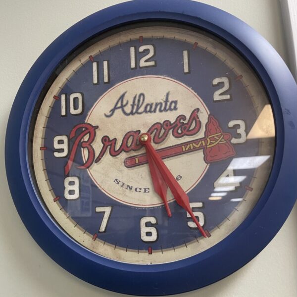 vintage-style wall clock featuring the Atlanta Braves log